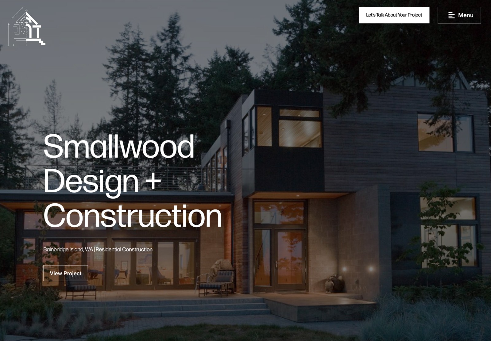 A modern house with lots of windows is in the background of large white text that reads, "Smallwood Design + Architecture"